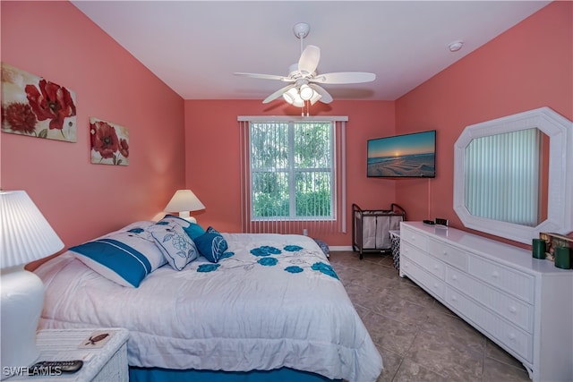 bedroom featuring tile patterned floors and ceiling fan