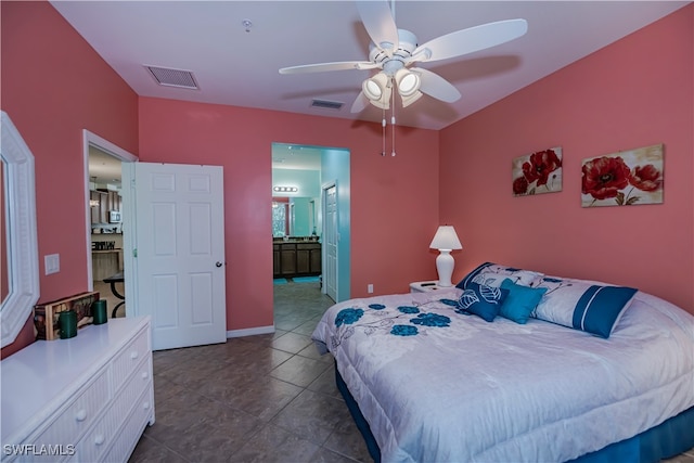 bedroom featuring connected bathroom, ceiling fan, and dark tile patterned floors