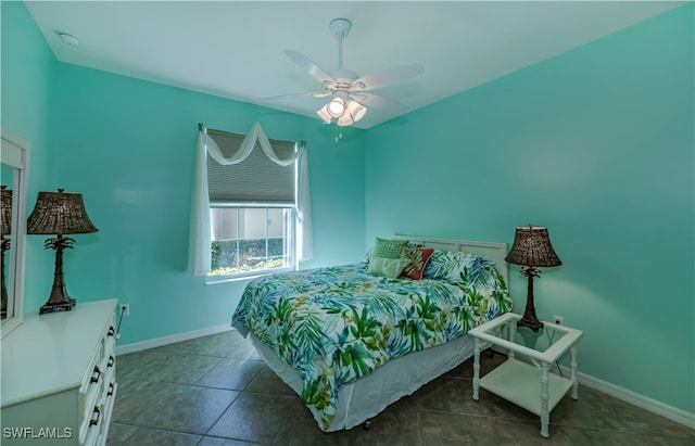 tiled bedroom with ceiling fan