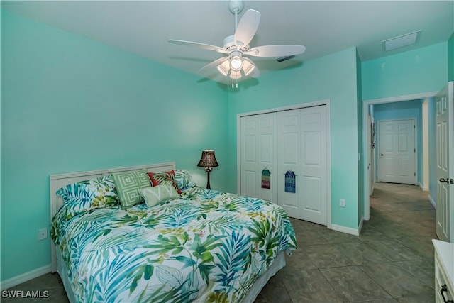 tiled bedroom with a closet and ceiling fan