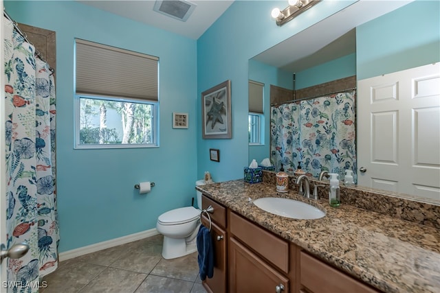 bathroom with vanity, toilet, walk in shower, and tile patterned flooring