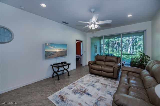 living room featuring ceiling fan and tile patterned floors