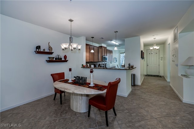 dining area with a notable chandelier