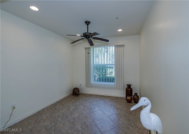 spare room with ceiling fan