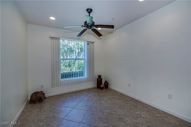 spare room with ceiling fan