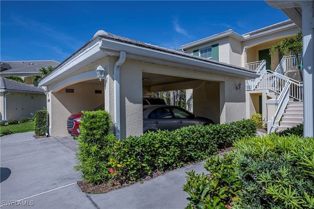 view of side of property featuring a carport