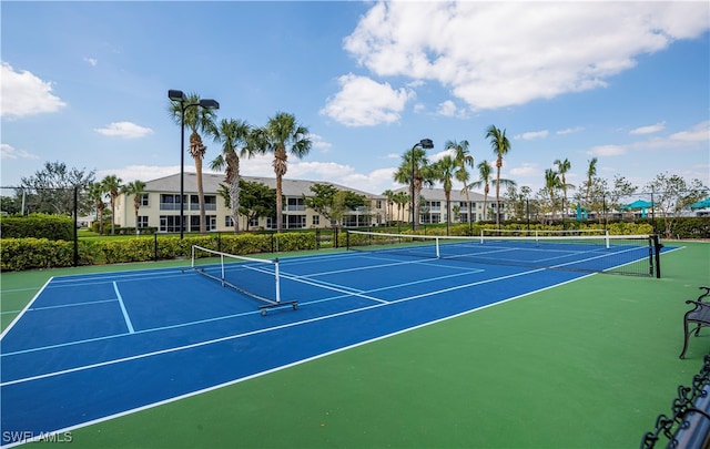 view of sport court with basketball hoop