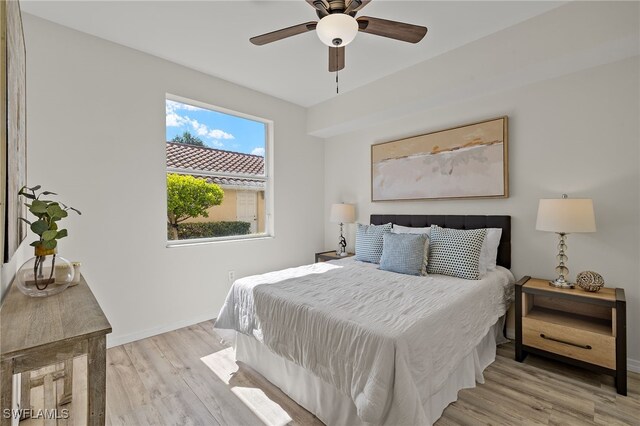 bedroom featuring light hardwood / wood-style flooring and ceiling fan