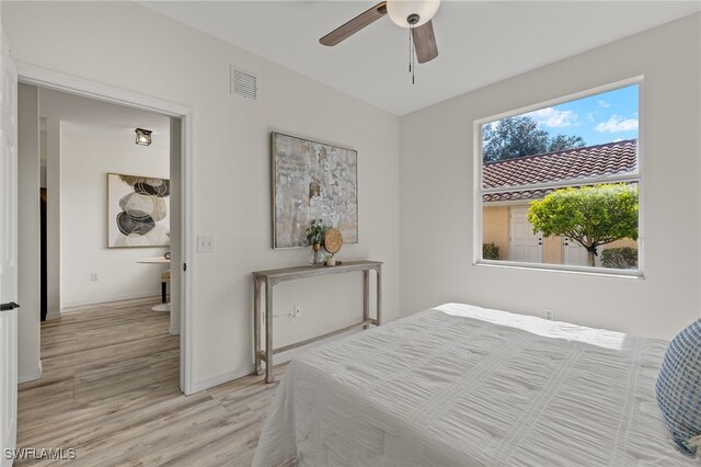 bedroom featuring light wood-type flooring and ceiling fan