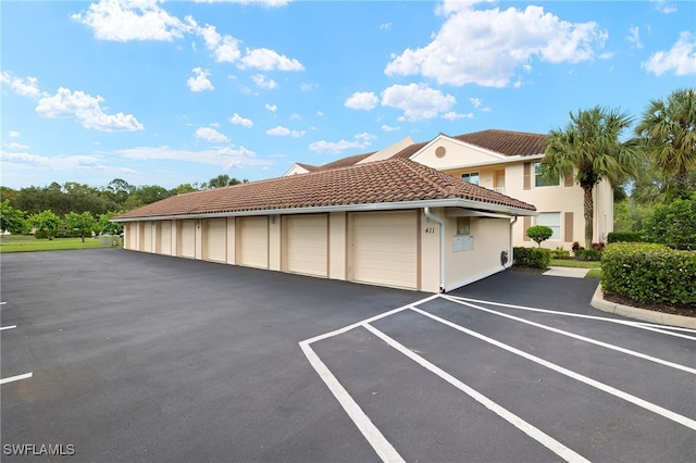 view of car parking with a garage