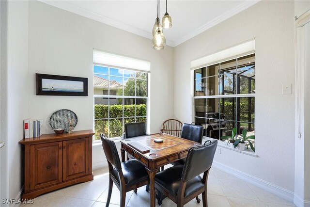 dining space with light tile patterned floors, baseboards, and ornamental molding