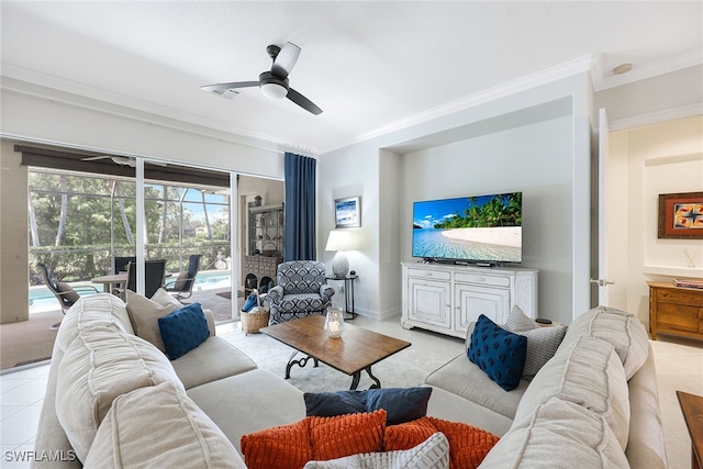 living area featuring light tile patterned floors, baseboards, a sunroom, ceiling fan, and ornamental molding