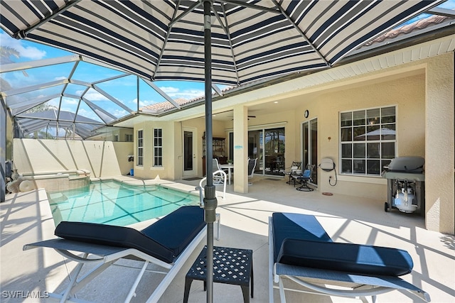 view of swimming pool featuring a lanai, a patio area, a grill, and a pool with connected hot tub