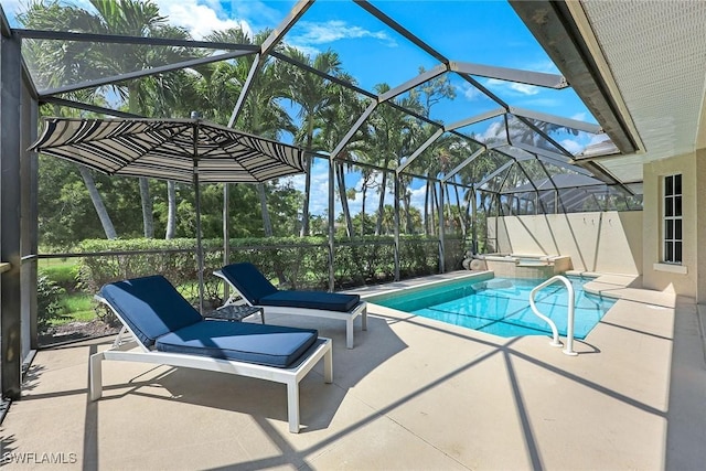 view of swimming pool with a pool with connected hot tub, a lanai, and a patio