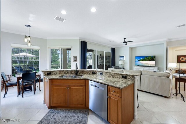 kitchen with visible vents, dishwasher, brown cabinets, light stone countertops, and a sink