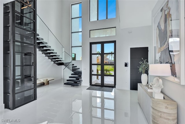 entrance foyer featuring a high ceiling and french doors