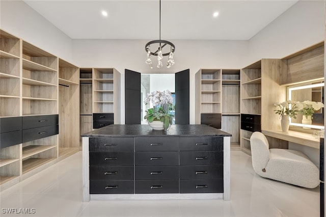 spacious closet featuring light tile patterned flooring