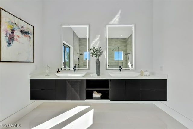 bathroom with tile patterned floors, vanity, and a shower with door