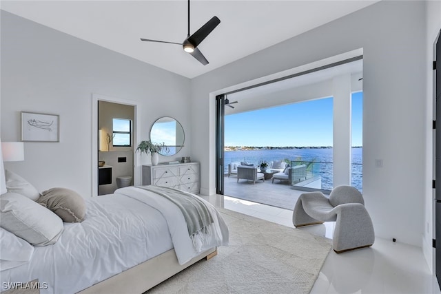 bedroom with ceiling fan, a water view, and light tile patterned floors