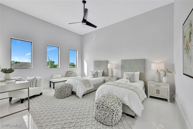 bedroom with multiple windows and ceiling fan