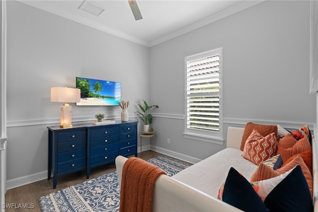 sitting room with ornamental molding, ceiling fan, and dark hardwood / wood-style floors