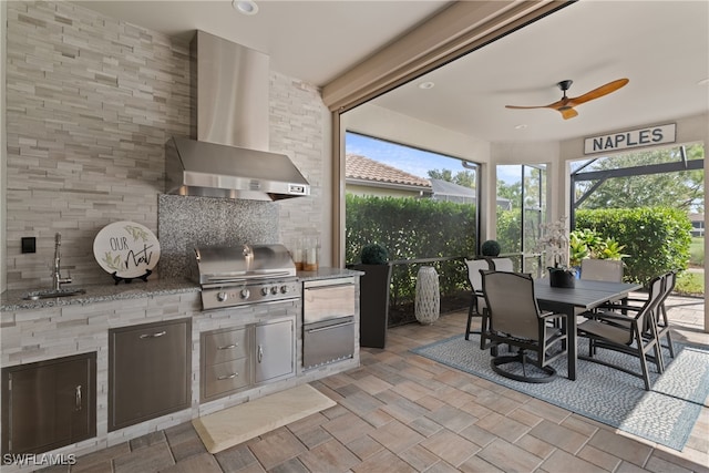 view of patio featuring ceiling fan, area for grilling, grilling area, and sink