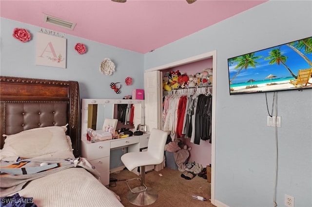 bedroom with carpet and a closet