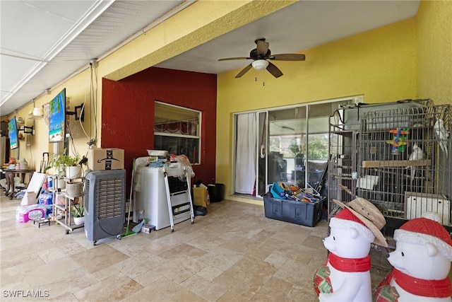 view of patio featuring ceiling fan