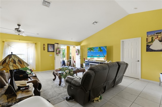 tiled living room with ceiling fan and lofted ceiling