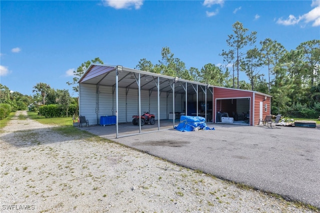 exterior space with an outdoor structure and a carport