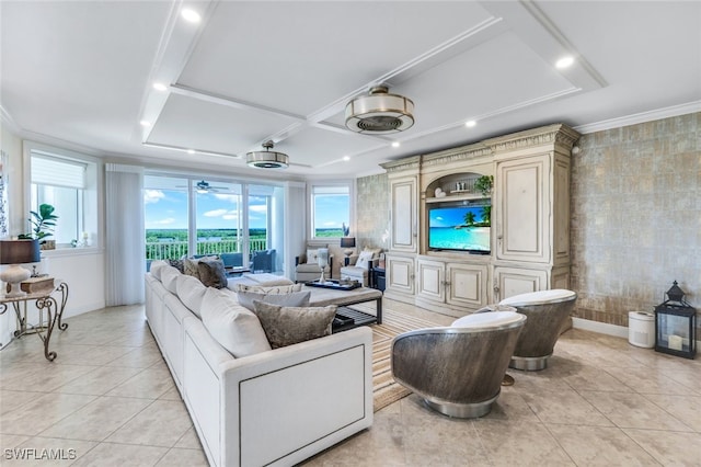 tiled living room with ornamental molding and plenty of natural light