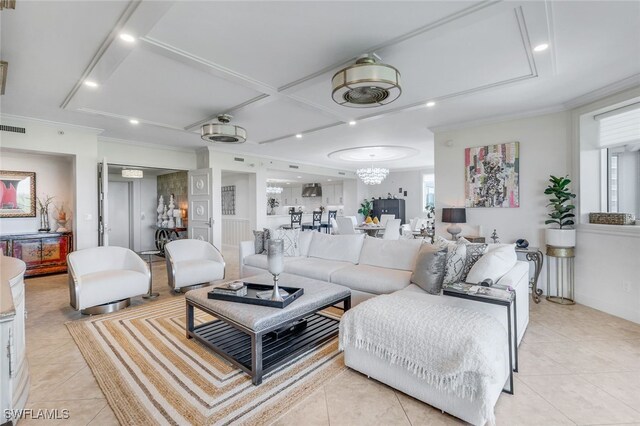 tiled living room with a healthy amount of sunlight and ornamental molding