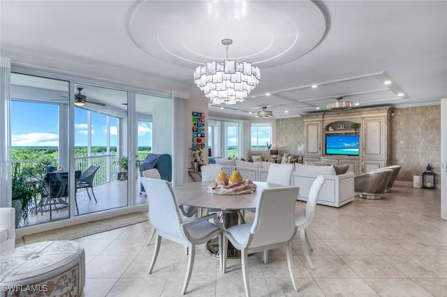 tiled dining room featuring ceiling fan with notable chandelier and plenty of natural light