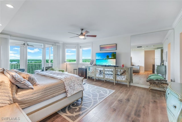 bedroom with ceiling fan, access to outside, wood-type flooring, and ornamental molding