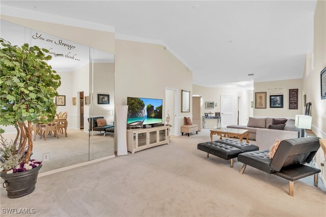 carpeted living room featuring lofted ceiling and crown molding