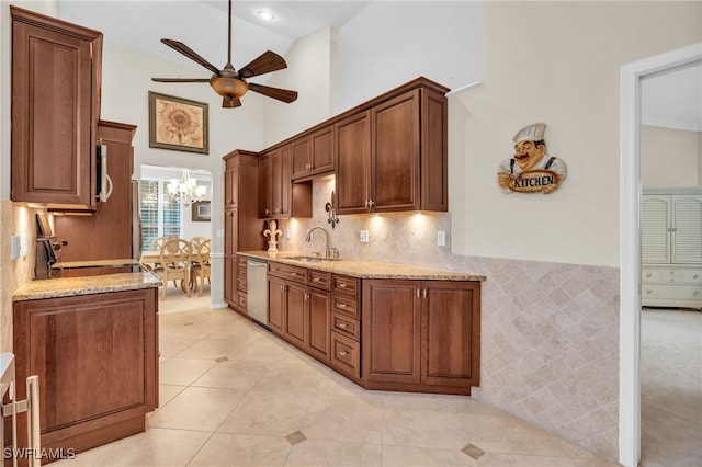 kitchen with light tile patterned floors, range, high vaulted ceiling, dishwasher, and light stone countertops