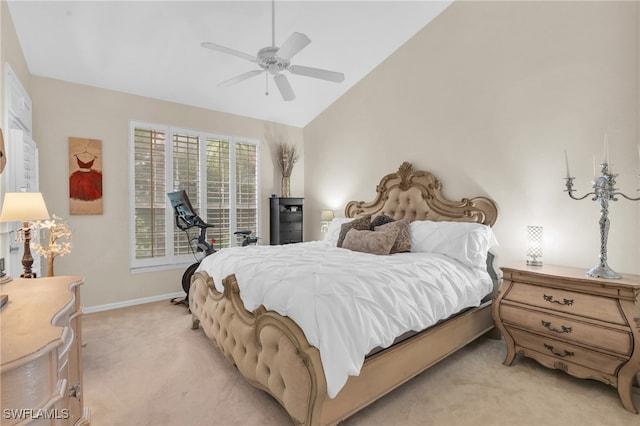 bedroom featuring ceiling fan, light carpet, and vaulted ceiling