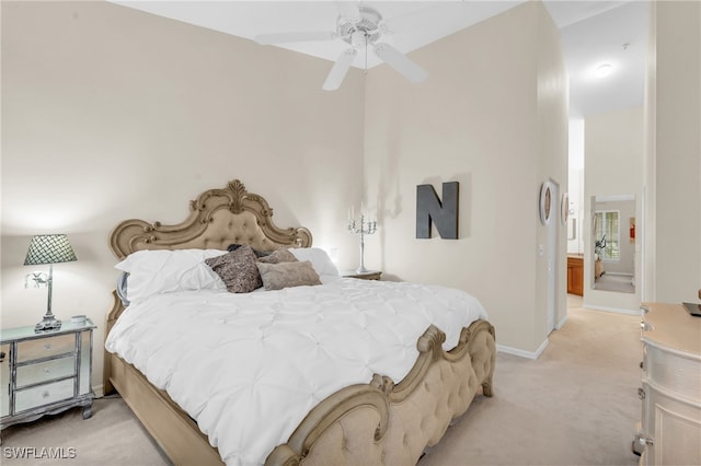 bedroom featuring light carpet and ceiling fan