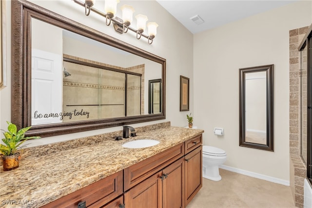 bathroom featuring a shower with shower door, vanity, and toilet