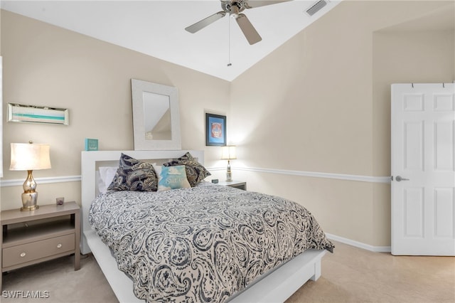 bedroom with light carpet, ceiling fan, and vaulted ceiling