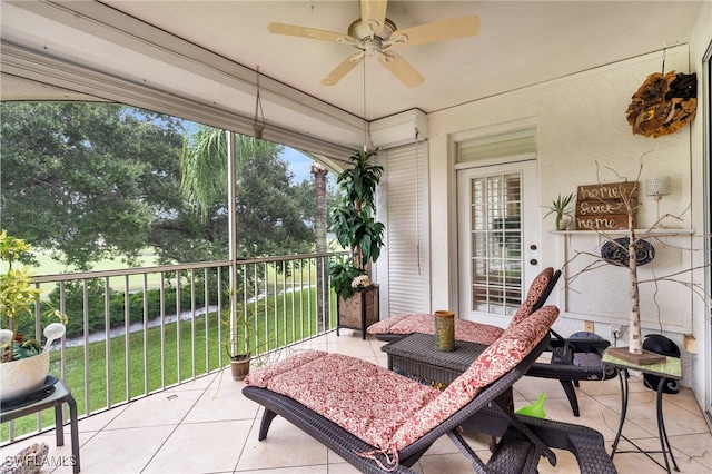 sunroom / solarium with ceiling fan and a wealth of natural light