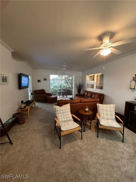 living room featuring ceiling fan, carpet floors, and ornamental molding