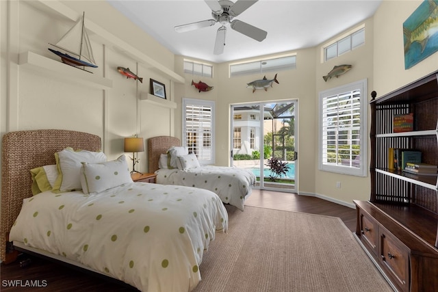 bedroom featuring ceiling fan, access to outside, and dark hardwood / wood-style flooring