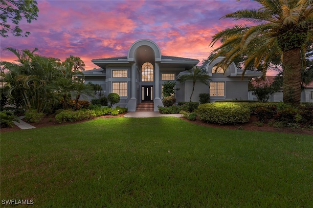 view of front of home with a lawn