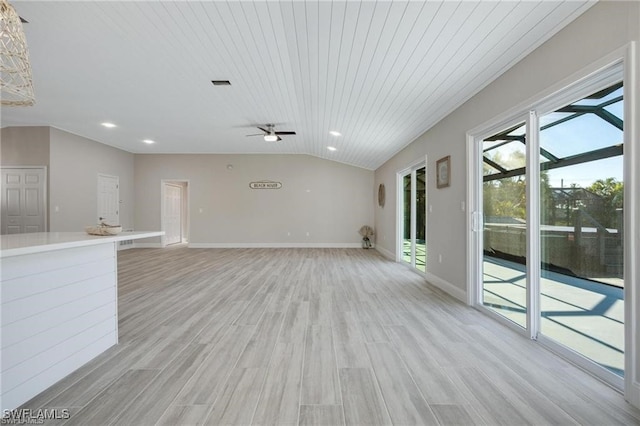 unfurnished living room with light hardwood / wood-style flooring, wood ceiling, lofted ceiling, and ceiling fan