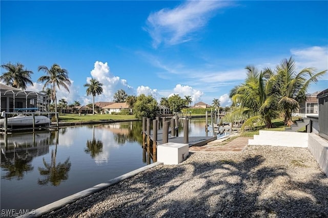 view of dock with a water view and a lanai