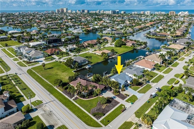 birds eye view of property with a water view