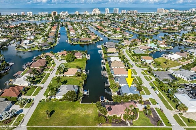 birds eye view of property featuring a water view