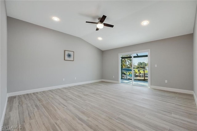 unfurnished room featuring light wood-type flooring, lofted ceiling, and ceiling fan