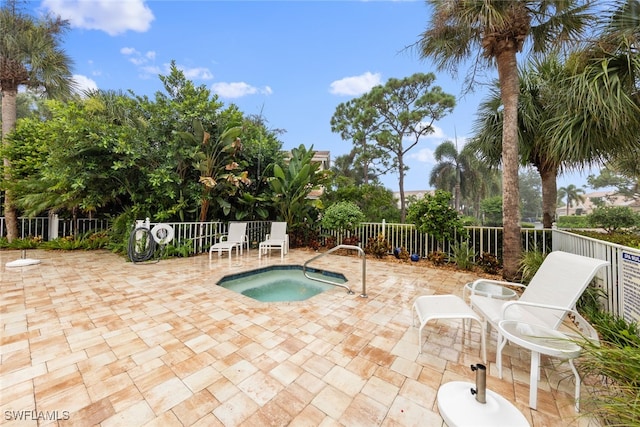 view of pool with a community hot tub and a patio area